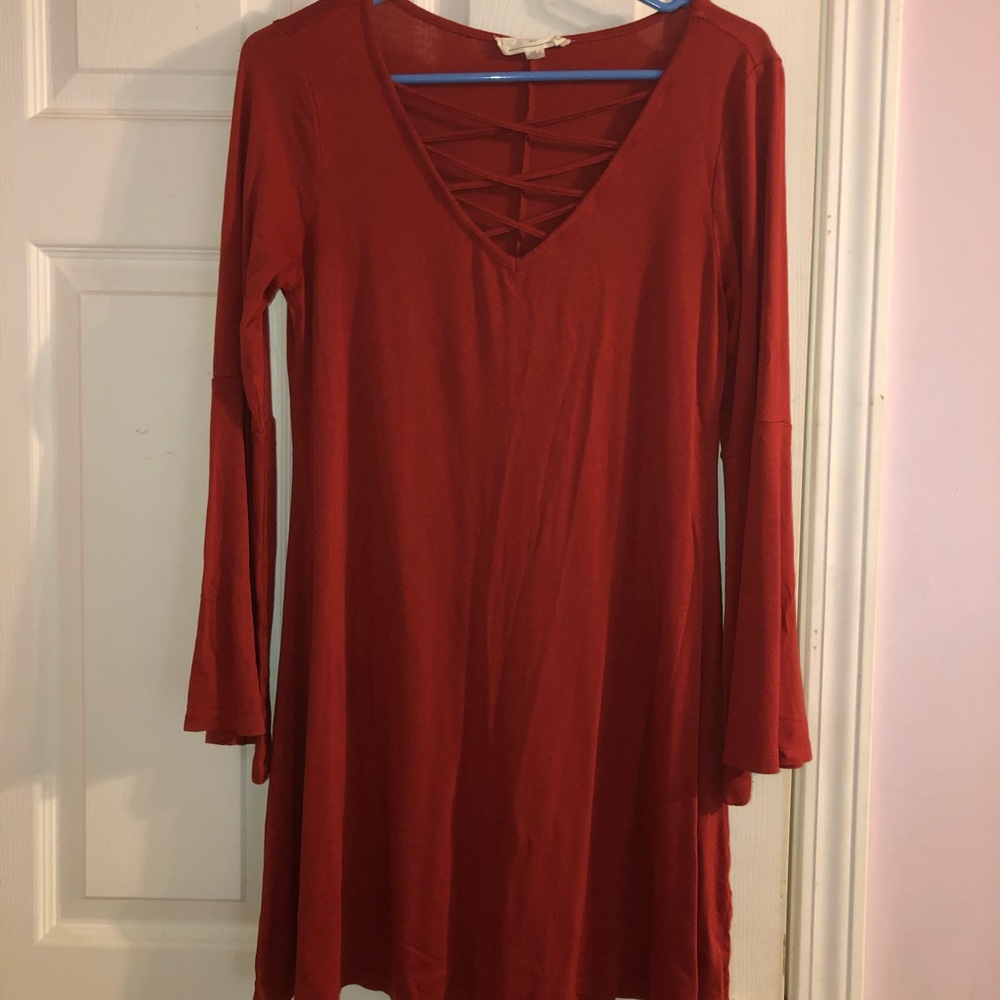 Burnt orange/red dress. Fit and flare.